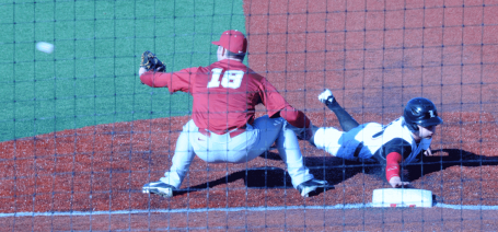 Adam Engel slides back into first base safely. He would steal a base in the 14th inning and score the winning run against Alabama when Cole Sturgeon got a bases-loaded walk.