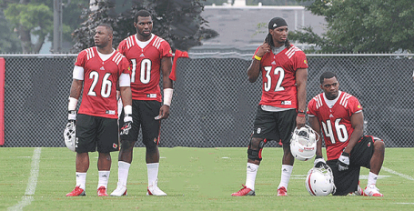 Taking a break during practice drills are running backs Michael Dyer, Dominique Brown, Senorise Perry and DeAngelo Thomas