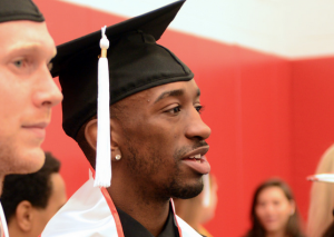Tim Henderson and Russ Smith prepare for commencement ceremonies.