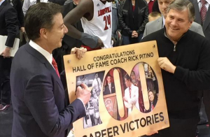Another milestone for Rick Pitino, accepting his latest plaque from Tom Jurich.