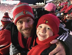 Andy and Eli Zehnder at Eli's first UofL football game (Photo by Charlie Springer).